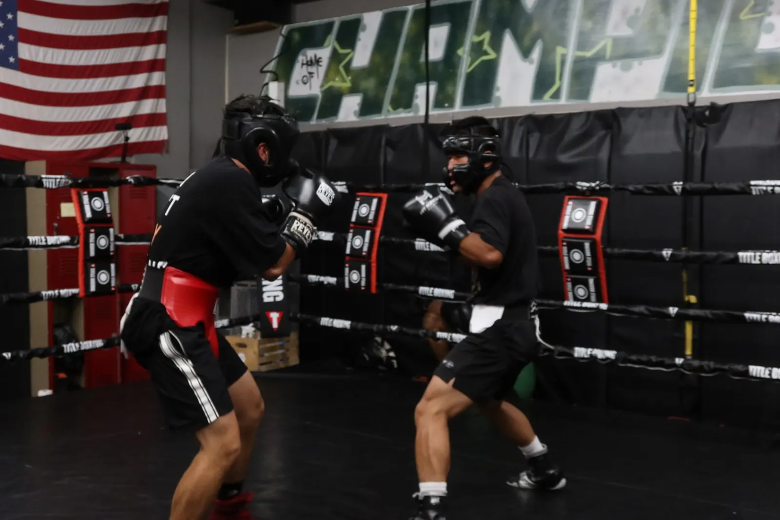 Two boxers sparring in headgear